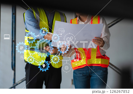 Construction engineers discussion with architects at construction site or building site 126267852