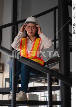 Concept of business failure and unemployment problem, unemployment stress Engineer sitting on stairs. Concept of business failure and unemployment problem, unemployment stress Engineer sitting on stairs. 126267883