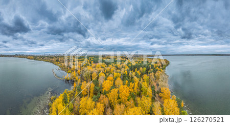Autumn forest on lake shore at sunset and city on horizon, auerial view Autumn forest on lake shore at sunset and city on horizon, auerial view 126270521
