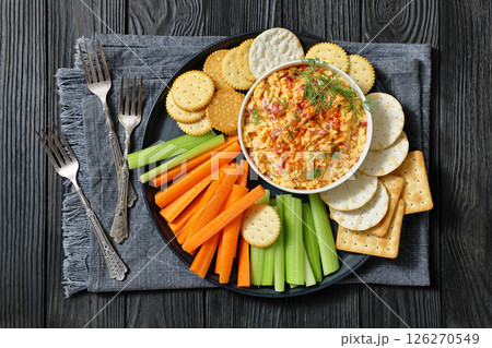 pimento cheese dip served with crackers, veggies 126270549
