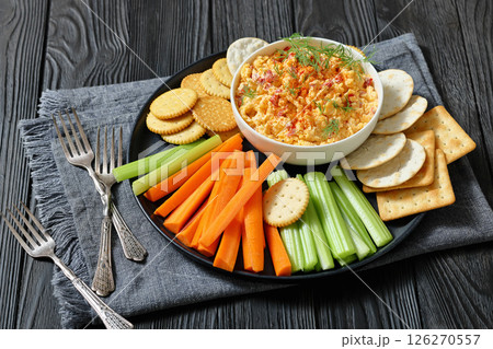 pimento cheese dip served with crackers, veggies pimento cheese dip served with crackers, veggies 126270557