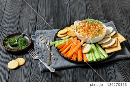 pimento cheese dip served with crackers, veggies 126270558