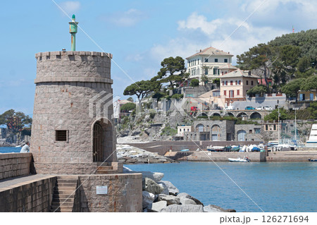 Stone old lighthouse in seafront town of Recco, Liguria. Nature, tourism and recreation, Italy. 126271694