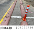 The curbs are overlapped with flexible orange traffic milestone and tape 126272756