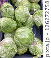 White cabbage lying on the counter at the store, vertical picture 126272758