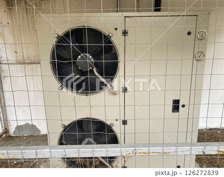 Exterior ventilation equipment on the building, helps to get rid of unstale odor in the kitchen of the premises 126272839