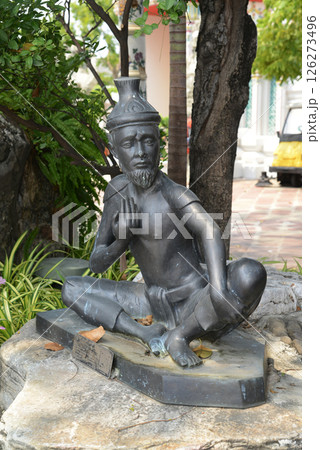 Statue of a hermit performing a massage therapy pose at Wat Phra Chetuphon Wimon Mangkhalaram or Wat Pho. This place is most famous for Thai massage. Located at Bangkok capital city in Thailand. 126273496