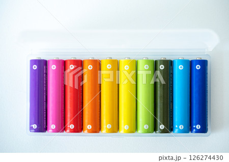 New colorful AAA battery in plastic box, rechargeable accumulator, closeup of alkaline batteries 126274430