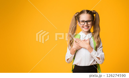 Thank You. Cute Schoolgirl Pressing Hands To Chest Expressing Gratitude To School Teachers Posing On Yellow Studio Background. Copy Space Thank You. Cute Schoolgirl Pressing Hands To Chest Expressing Gratitude To School Teachers Posing On Yellow Studio Background. Copy Space 126274590