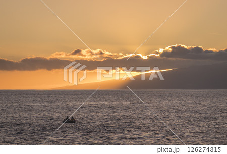 Orange sunset at sea shore promenade in Playa de San Juan, Tenerife, Spain in the south of Tenerife with fisherman boat Orange sunset at sea shore promenade in Playa de San Juan, Tenerife, Spain in the south of Tenerife with fisherman boat 126274815