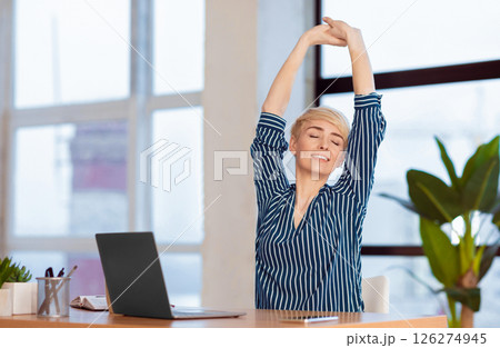 Break At Work. Entrepreneur Lady Stretching Hands With Eyes Closed Working At Laptop Sitting In Modern Office. Selective Focus Break At Work. Entrepreneur Lady Stretching Hands With Eyes Closed Working At Laptop Sitting In Modern Office. Selective Focus 126274945