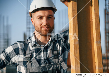 Confident worker. Man is on the construction site at daytime Confident worker. Man is on the construction site at daytime 126275286