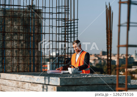 Man is working on the construction site at daytime 126275516