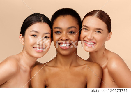 Skin And Body Care. Three Multicultural Ladies Models Posing Smiling At Camera On Beige Studio Background 126275771