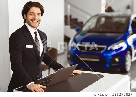 Successful Dealer. Car Sales Manager Standing At Desk In Luxury Dealership Office, Looking At Camera, Copyspace 126275827