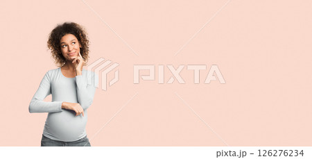 Pregnant woman dreaming, imagining motherhood life over white background with free space, panorama 126276234
