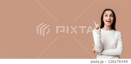 Great Idea. Young Latin Woman Pointing Finger Up, Having Problem Solution, Posing Over Yellow Background With Empty Space, Panorama Great Idea. Young Latin Woman Pointing Finger Up, Having Problem Solution, Posing Over Yellow Background With Empty Space, Panorama 126276349