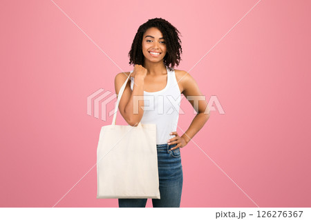 Zero Waste Concept. Black woman with eco tote bag over white studio background. Panorama, mockup, copy space 126276367