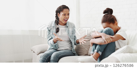 African american girl shouting at younger sister, fighting at home, little girl crying, empty space African american girl shouting at younger sister, fighting at home, little girl crying, empty space 126276586