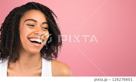 Emotions Concept. Happy afro girl laughing and looking at empty space on white background, panorama 126276601