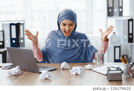 Deadline Stress Concept. Angry Arabic Woman Office Employee Having Nervous Breakdown At Workplace, Shouting And Emotionally Gesturing 126276628