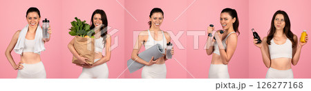 A fit woman stands confidently against a pink backdrop, holding various items like a water bottle, exercise mat, and fresh produce, promoting a healthy lifestyle and fitness routine. 126277168