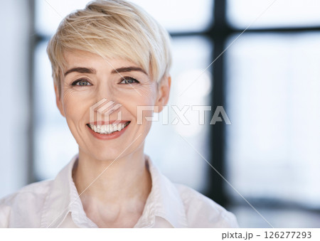 Portrait Of Happy Businesswoman Smiling Looking At Camera Posing In Modern Office. Successful Business People. Selective Focus Portrait Of Happy Businesswoman Smiling Looking At Camera Posing In Modern Office. Successful Business People. Selective Focus 126277293