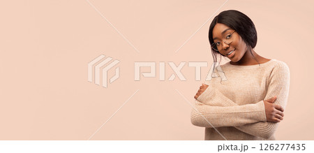 African American Woman Looking At Camera Crossing Hands Standing On Pink Background. Studio Shot African American Woman Looking At Camera Crossing Hands Standing On Pink Background. Studio Shot 126277435