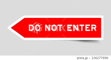 Red color arrow shape sticker label with word do not enter on gray background 126277890