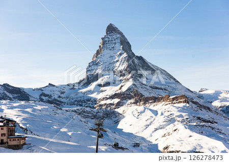 Snowy mountain Matterhorn during the day in winter. Zermatt, swiss alps 126278473