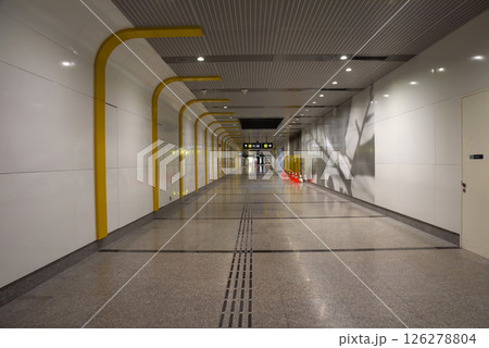 Singapore, Singapore - 4 April 2025: Interior view of underground MRT station passageway connecting to Exit 1 and 2 for Gardens by the Bay, showing modern subway architecture with directional signs Singapore, Singapore - 4 April 2025: Interior view of underground MRT station passageway connecting to Exit 1 and 2 for Gardens by the Bay, showing modern subway architecture with directional signs 126278804