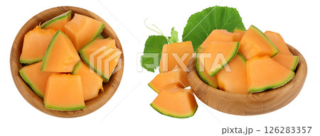 Cantaloupe melon pieces in wooden bowl isolated on white background with full depth of field. Top view. Flat lay 126283357