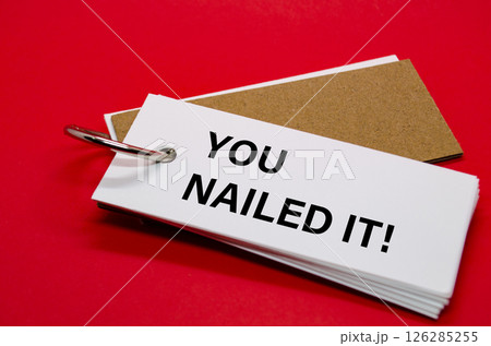 YOU NAILED IT text on white notepad. A Simple Gesture, A Powerful Message of Recognition and Encouragement 126285255