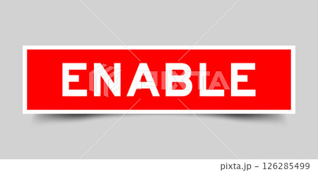 Red color square label sticker with word enable that inserted in gray background 126285499