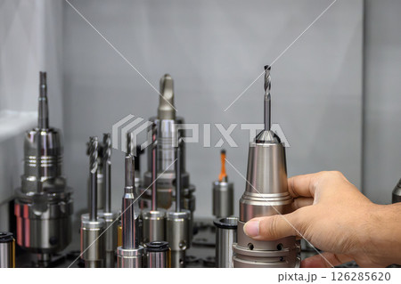 The group of cutting tools for CNC machine in the light blue scene. The group of cutting tools for CNC machine in the light blue scene. 126285620