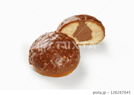 Chocolate-covered hazelnut cakes showing soft inside with filling Chocolate-covered hazelnut cakes showing soft inside with filling 126287845