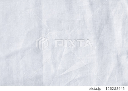 Close-up of white fabric texture with crumples and subtle details Close-up of white fabric texture with crumples and subtle details 126288443