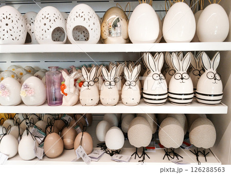 Kamyanets-Podilskyi, Ukraine - April 4, 2025 - Easter-themed ceramic decorations are displayed on store shelves. 126288563