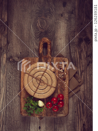 raw spiral sausages, on a wooden board, top view, no people, raw spiral sausages, on a wooden board, top view, no people, 126289181