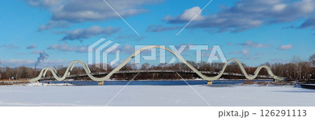 Kyiv, Ukraine February 16, 2025: New bridge "Volna" Obolonsky island Park "Natalka" in Kyiv Kyiv, Ukraine February 16, 2025: New bridge "Volna" Obolonsky island Park "Natalka" in Kyiv 126291113