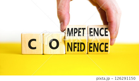 Competence and confidence symbol. Concept word Competence Confidence on wooden cubes. Businessman hand. Beautiful yellow table white background. Business competence confidence concept. Copy space. 126291150