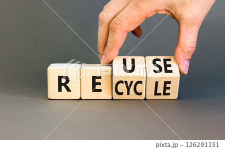 Reuse or recycle symbol. Concept words Reuse Recycle on wooden block. Beautiful grey table grey background. Businessman hand. Business reuse or recycle concept. Copy space. Reuse or recycle symbol. Concept words Reuse Recycle on wooden block. Beautiful grey table grey background. Businessman hand. Business reuse or recycle concept. Copy space. 126291151
