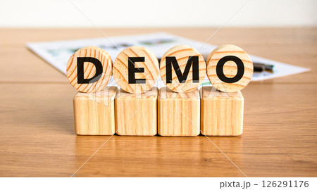 Demo symbol. Concept word Demo on beautiful wooden circles on wooden blocks. Beautiful wooden table white background. Business and demo concept. Copy space. 126291176