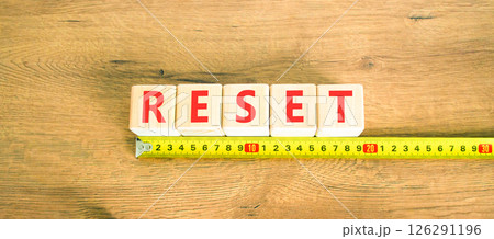 Reset symbol. Concept word Reset on beautiful wooden blocks. Beautiful wooden table wooden background. Beautiful yellow ruler. Business lifestyle reset concept. Copy space. 126291196