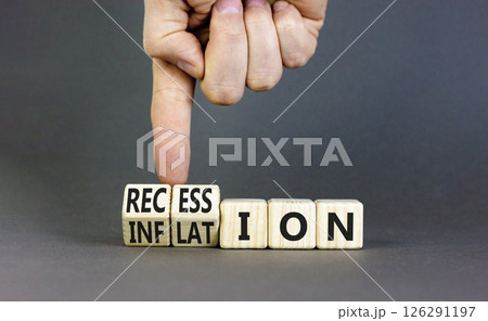 Inflation recession symbol. Businessman turns wooden cubes and changes word Recession to Inflation. Beautiful grey table grey background. Business and inflation or recession concept. Copy space. Inflation recession symbol. Businessman turns wooden cubes and changes word Recession to Inflation. Beautiful grey table grey background. Business and inflation or recession concept. Copy space. 126291197