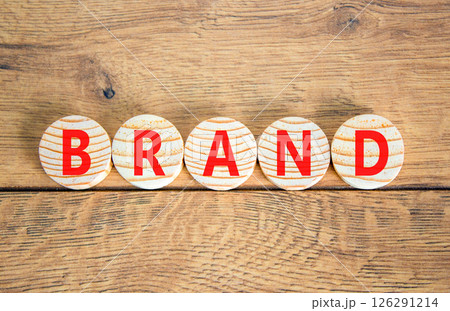 Brand symbol. Concept word Brand on beautiful wooden circles. Beautiful wooden table wooden background. Business brand concept. Copy space. Brand symbol. Concept word Brand on beautiful wooden circles. Beautiful wooden table wooden background. Business brand concept. Copy space. 126291214