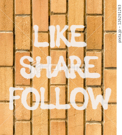 Like share follow symbol. Concept words Like Share Follow on beautiful brown brick wall. Beautiful brown brick wall background. Business like share follow concept. Copy space. 126291263