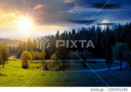 day and night time change concept. road winding through forest in mountain landscape. nature scenery on autumn equinox. cloudy sky with sun and moon 126291286