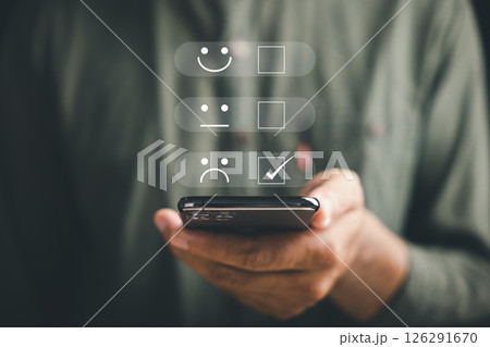 Unhappy client concept. Person holding smartphone showing one star rating. Expressing disappointment and sadness. Negative review, bad service, low satisfaction. dissatisfaction on business reputation 126291670