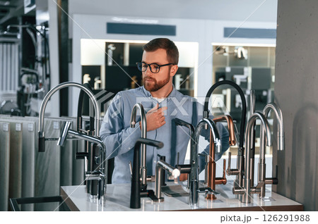 Man chooses a products in a sanitary ware store 126291988